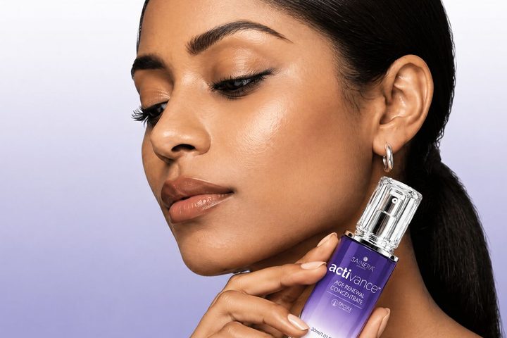 Woman holding Activance Age Renewal Concentrate
