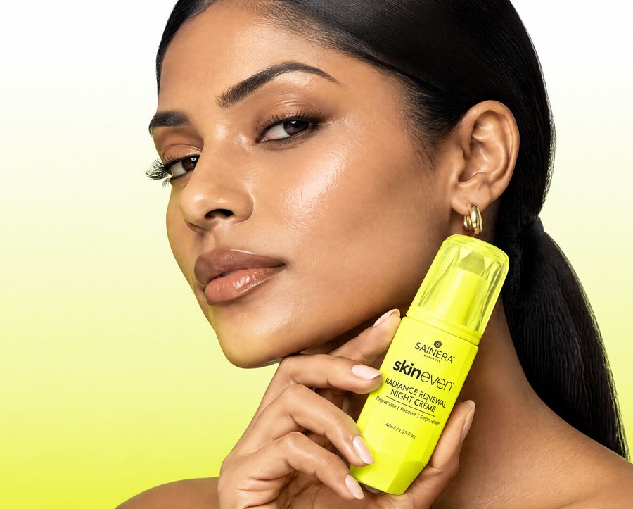 Model holding Sainera Skineven Radiance Renewal Night Cream