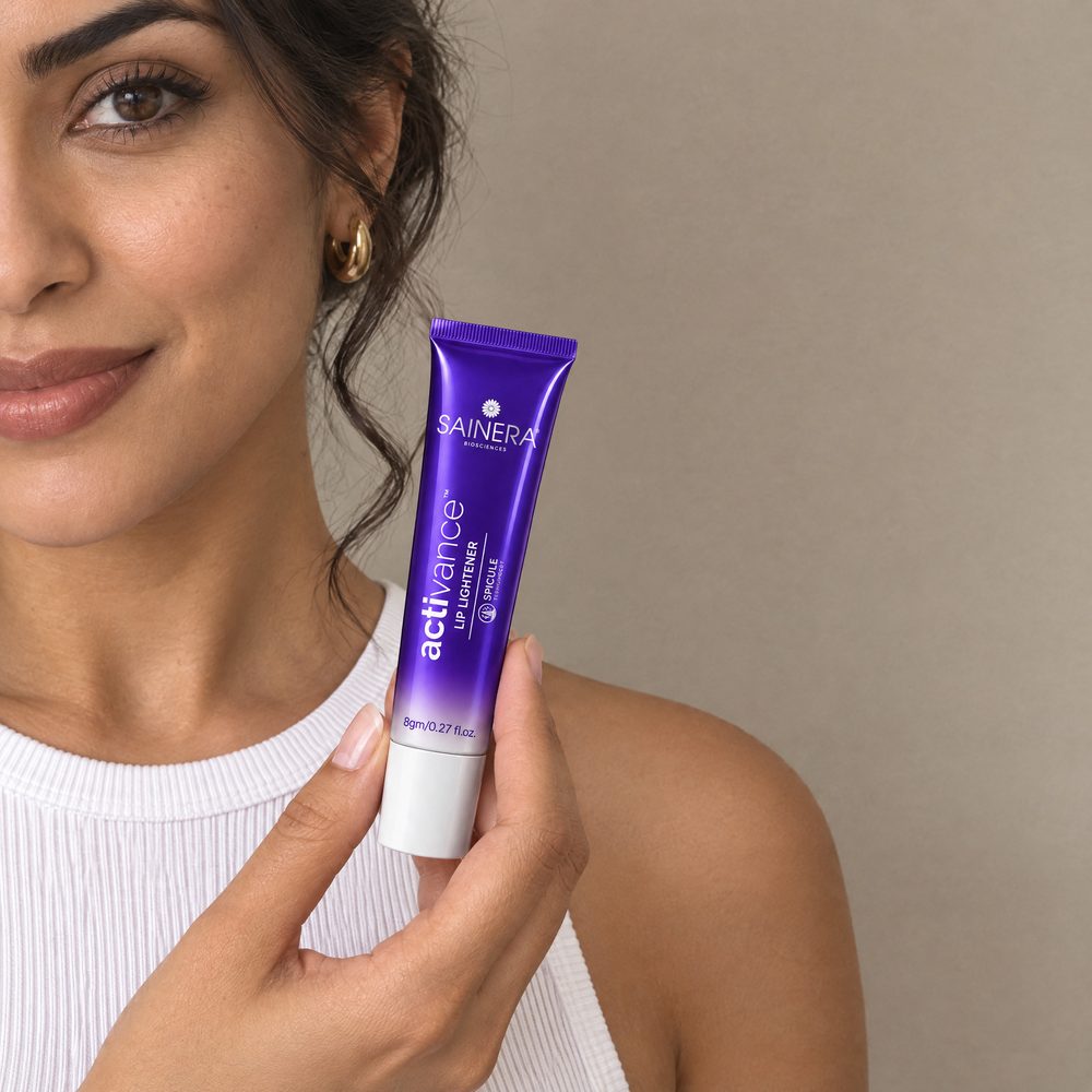 Woman holding Activance Lip Lightener