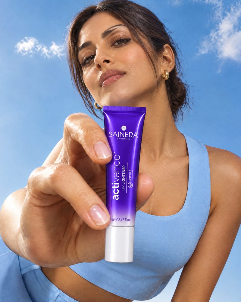 Woman holding Activance Lip Lightener