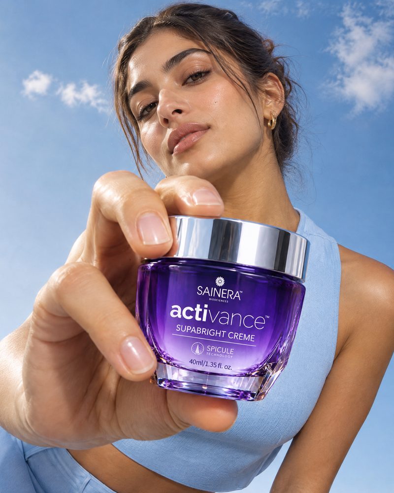 Woman holding Activance Supabright Cream