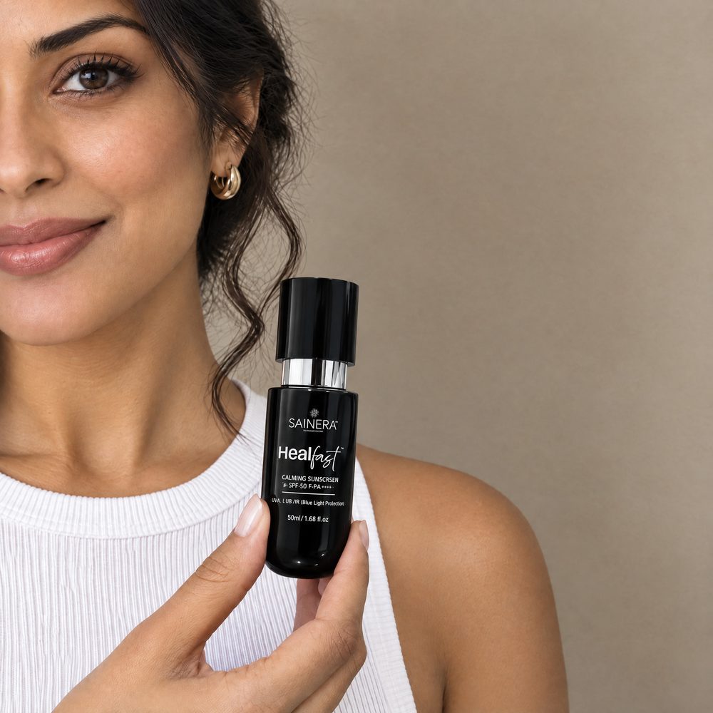 Woman holding Healfast Calming Sunscreen SPF 80 PA++++