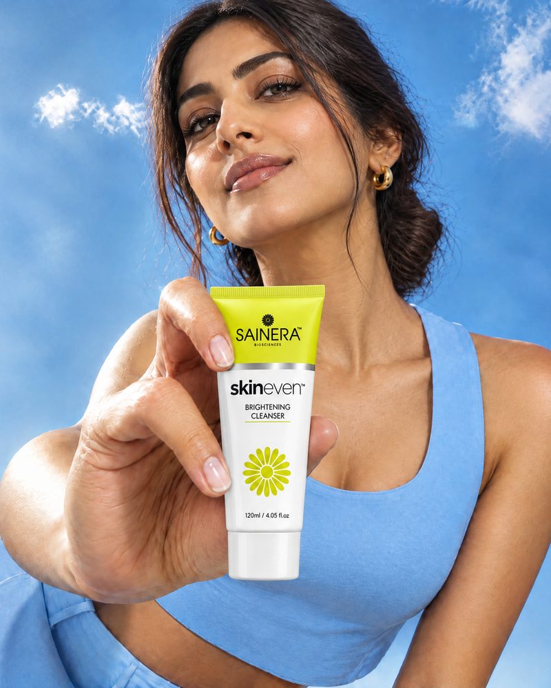 Woman holding Skineven Brightening Cleanser