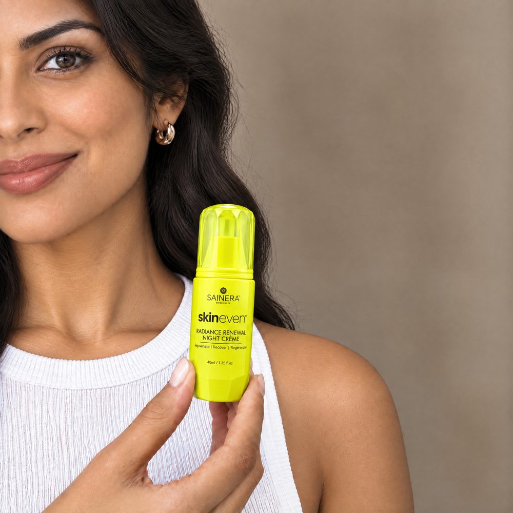 Woman holding Skineven Radiance Renewal Night Cream